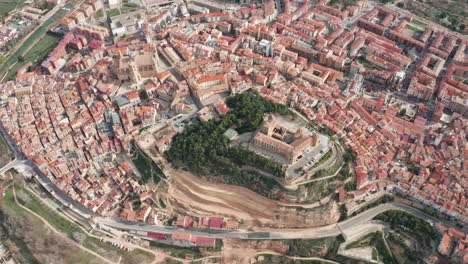 Large-top-aerial-view-over-Alcaniz-nothern-Spain-city-river-Guadalope